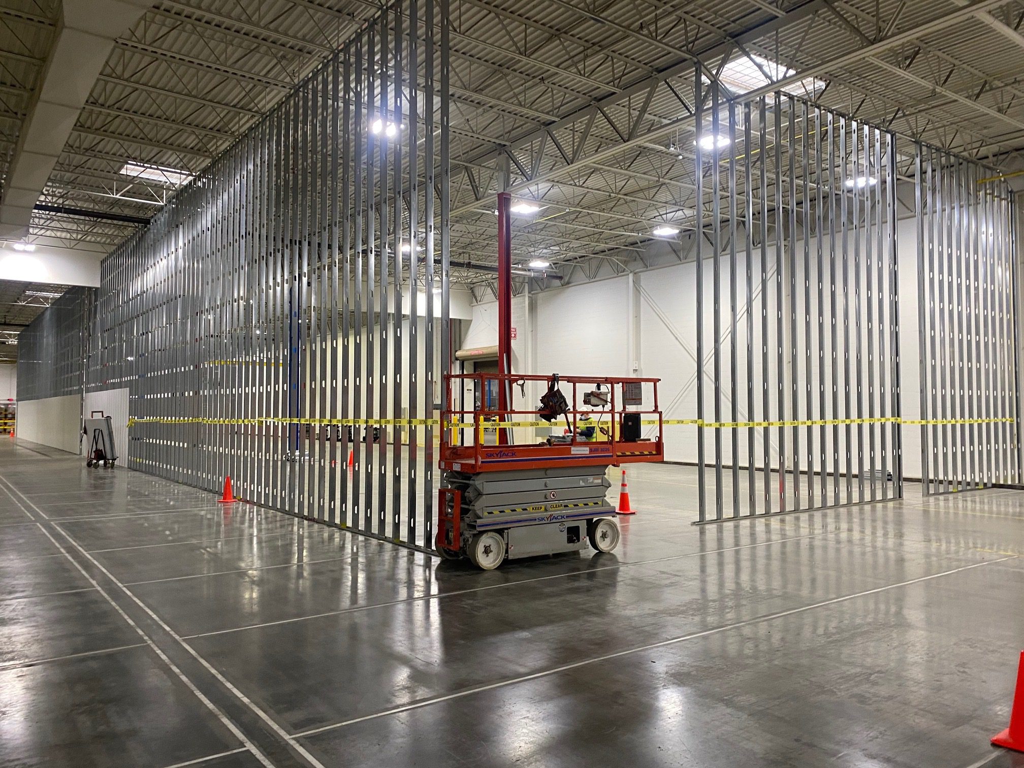 Interior partition framing under construction in a large facility